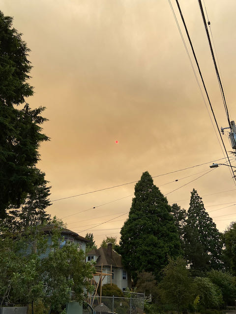 Red sun over house being rebuilt